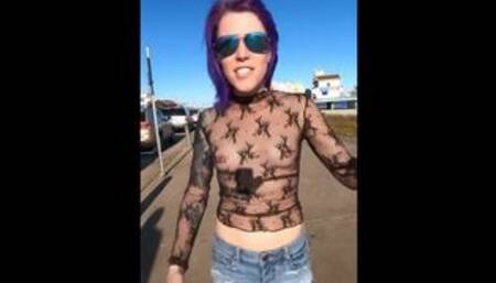 See through top on busy beach street tits on display