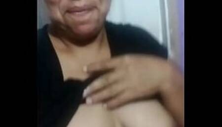 Shy but sexy latina housewife showing her natural tits by WhatsApp. She has nice dark nipples. Her name is Marcela