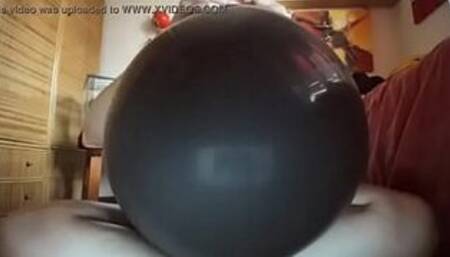 A huge black balloon will be used as if it were a big hard cock!