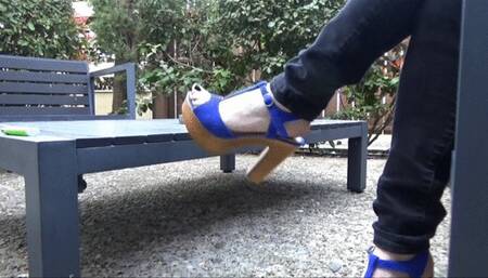 High heels dangling outdoors