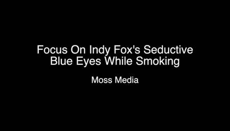 Focus on Indy Fox seductive eyes while smoking on a patio