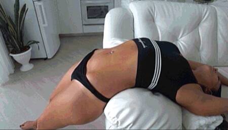 Stretched belly on the edge of the sofa d