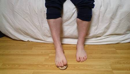 Male feet Crushing doughy doughnut