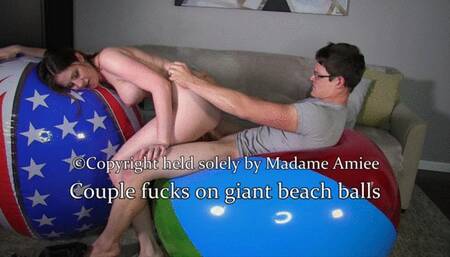 Couple fucks on giant beach balls [720]