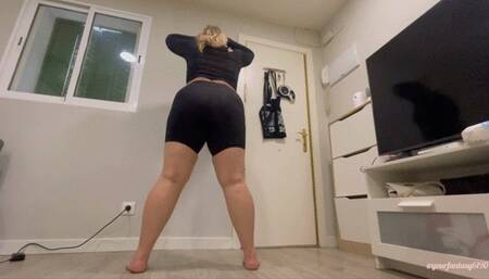 Gassy squats in short black leggings
