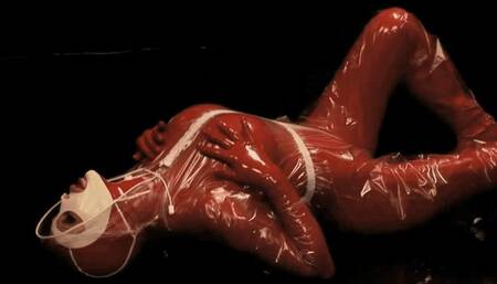 The Red Rubber Mystic Girl Masturbates In Latex And Plastic Body Overall