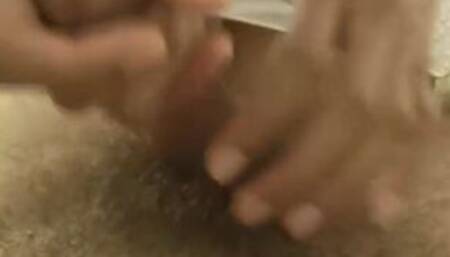 Asian slut grabs on the cock and wanks it in close up