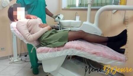 The services of the dentist and his assistant give a beautiful smile to the young and eager patient