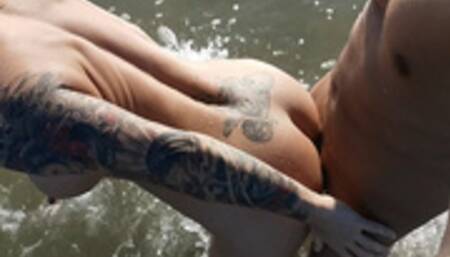 Fit blonde babe with big ass fucks on a public beach. WetKelly