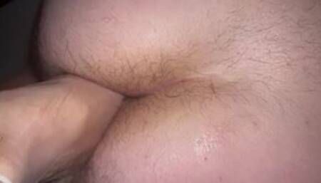 Horny hot milf foot fucks his ass to wake him up with a condom on her foot