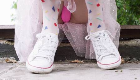 Foxy blonde Eva Elfie is playing with her pussy in the yard