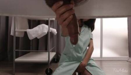 A beautiful masseuse gives a hot massage to a man on a milking table.