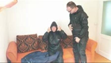 Man and girl in shiny nylon rainwear - 101