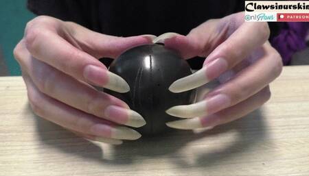 nails scratching the ball - let's check what's inside