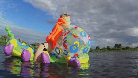 Alla rides a big rare inflatable caterpillar on the lake and blows away a big rare beach ball!!!