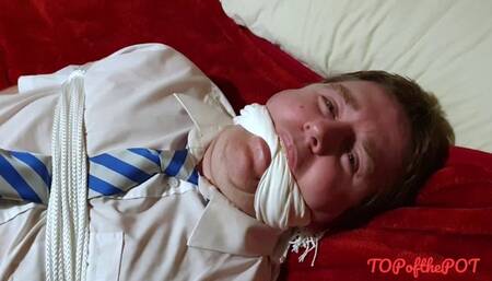 Handjob on Man tightly bound and gagged in adult school uniform on bed