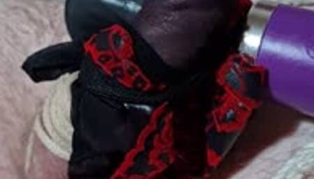 Stockings and wand used on naked man tied in futomomo bondage by woman