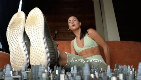 Giantess airing out stinky feet after workout