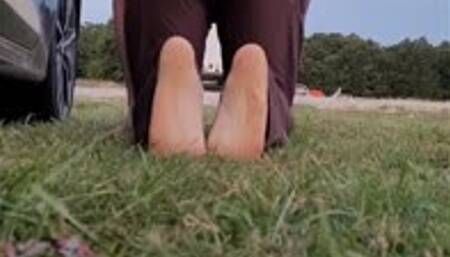 Sexy feet in wet grass