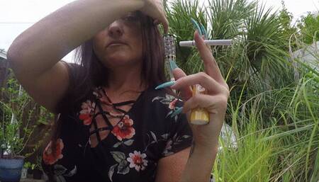 Glossy lips and long nails  in your face SMOKING