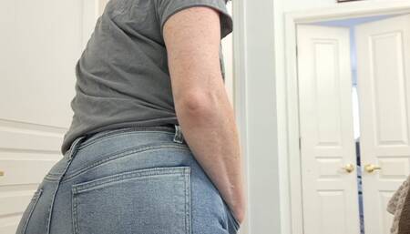 Peeing and modeling new jeans before leaving