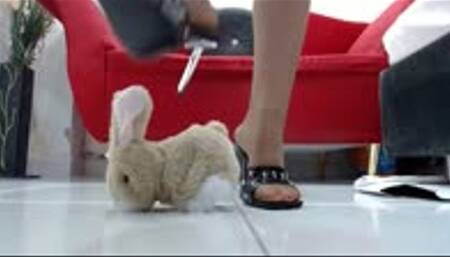 crushing very hard a toy bunny in nylons and heels, sandals