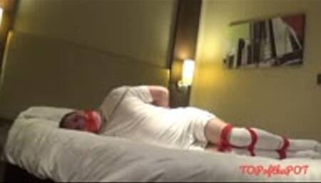 Footballer tied up and left on bed in hotel room