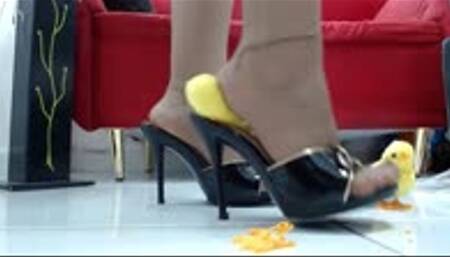 crushing  some toy chickens with heels, sandals and nylons