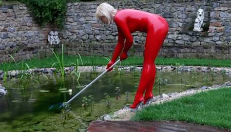 Blonde Slut in Red Latex Catsuit Works And Piss Outdoor In The Garden