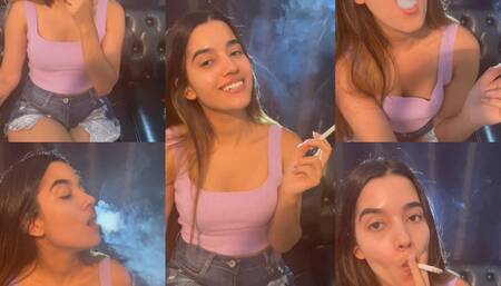 Feeding my lungs with Marlboro red in a purple top and short shorts