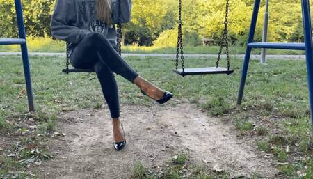 KIRA IS ON A PUBLIC PARK SWING IN HER HIGH HEELS - MP4 HD