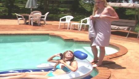 Girl-girl spanking in the pool