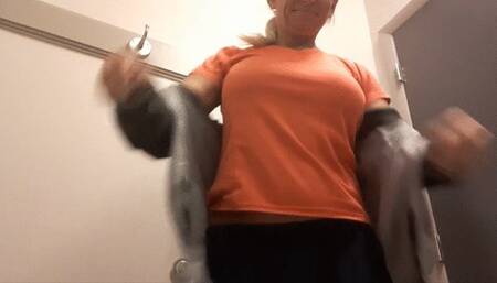 Trying on way too tight t-shirts with no bra in store fitting room