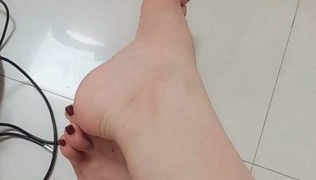 Sexy feet in strap high heel sandals