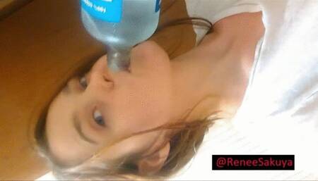 Drinking a detox drink, gagging and burping and coughing