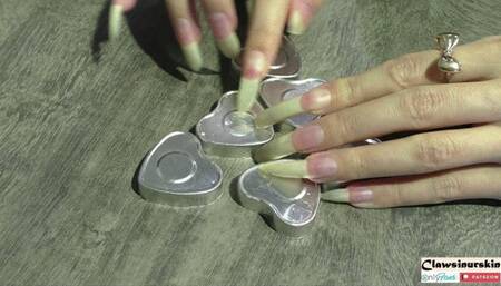 nails scratching hard, cutting and piercing metal