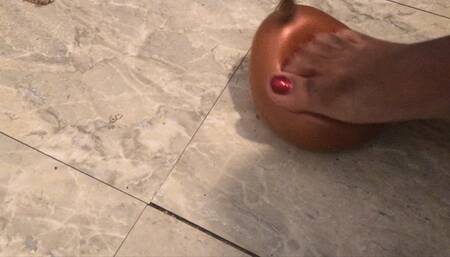 Stomping on  balloon barefoot
