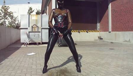 Pierced Latex Doll PEE Masturbates Monster Rubber Dildo and Pee in Black Stocking Micro Skirt Corset Mask Blouse and Gloves Stretched Nipples in Public P2