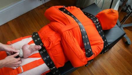 Squeeze an Orange - Patrick and Elise Graves - Elise Restrains Bondage Slut Patrick in Orange Straitjacket, Leg Binder and Hood before Teasing the Hell out of him!