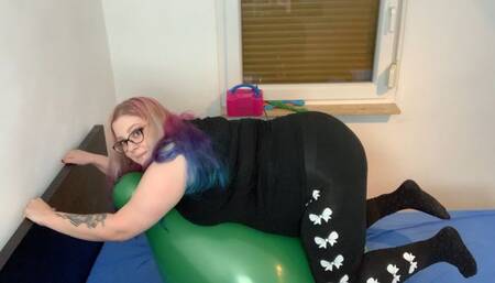 Riding and popping a 24 inch balloon