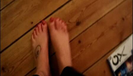 Reading a magazine with feet