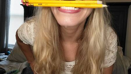 Holding a pencil then 5  in between my mouth