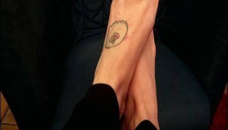 TF unwraps a chocolate bar and pours some water with her feet