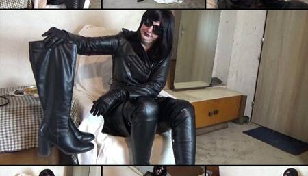Mistress in a leather coat and high boots