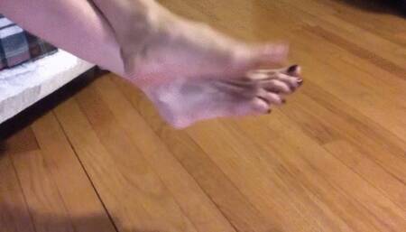 ANKLES CROSSED FOOT RUBBING