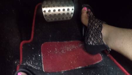 Hot pink toes high arches in black sandals PEDAL PUMPING