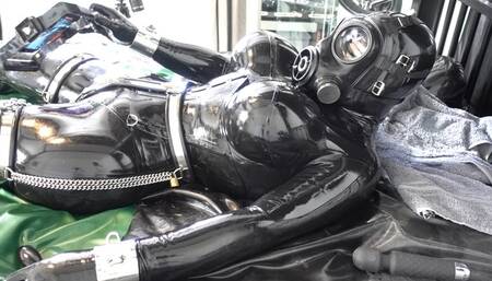 Locked & Chained on the bed doing my Social Media work in Heavy Rubber