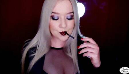 Chain smoking two black cigarettes