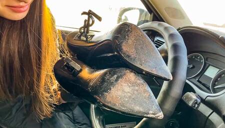 DRIVING Tanya is driving a car in leather ankle boots with high heels YSL