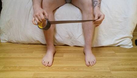 Binding my male feet up with brown tape